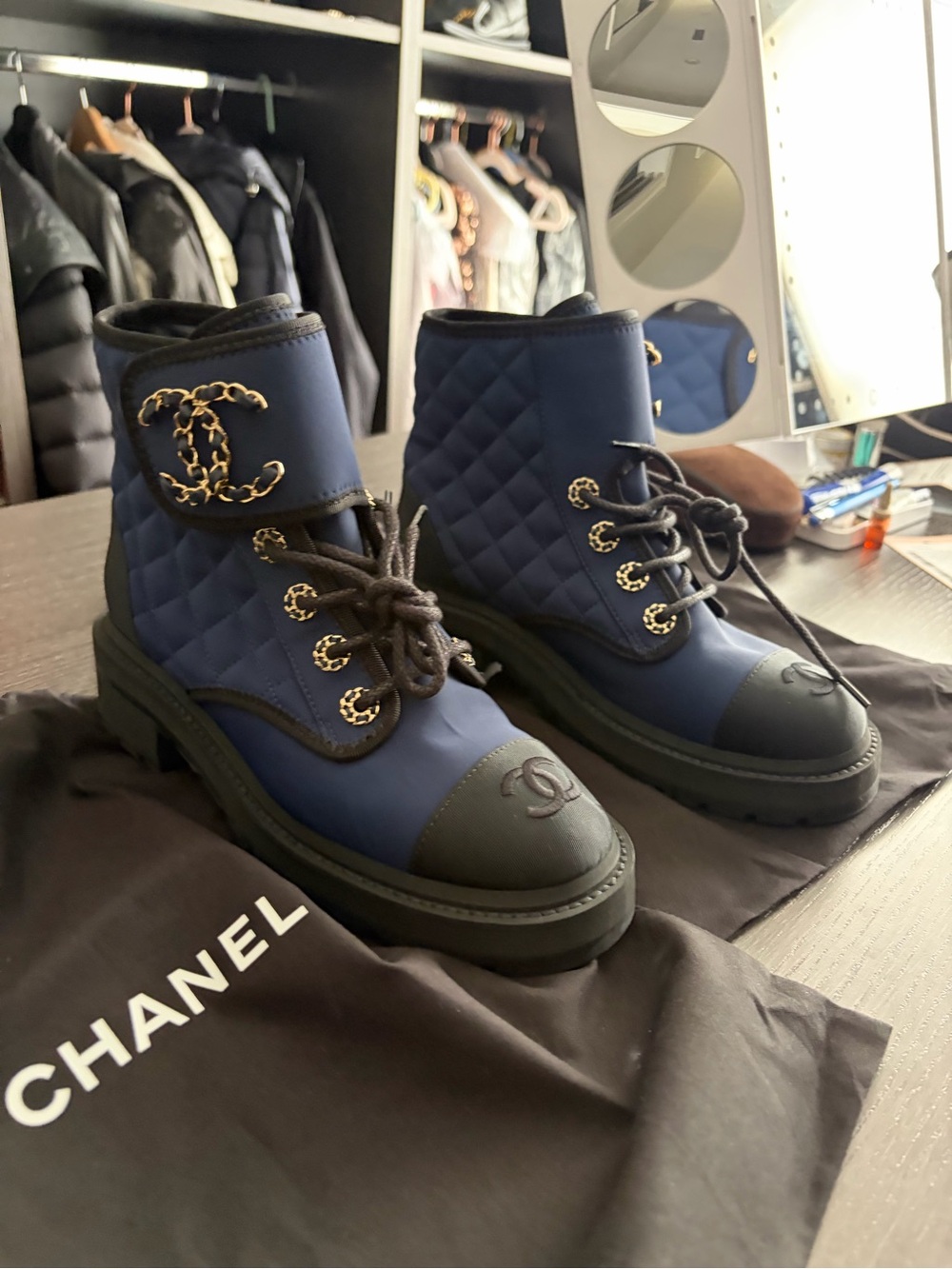 CHANEL Quilted Navy Lace-Up Combat Boots with Gold Chain CC